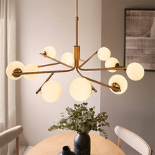 Load image into Gallery viewer, Aaron 10 Light Pendant Aged Brass in room with table set with pottery on it, LHEND118652, ceiling light, 
