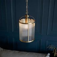 Lambeth 1 Light Ribbed Single Pendant - Antique Brass above grey sofa in blue walled sitting room, LHEND106710, ceiling pendant light,