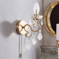 Matt brass wall sconce with crystal accents on a light grey wall. Matt Brass 1 Light Crystal Bathroom Wall Light, LHCLCB5937/1MB, wall light, 
