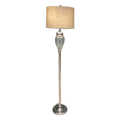 A floor lamp with a ribbed clear glass shade and a chrome metal finish. The lamp is turned on, showing the light reflecting off the shade.